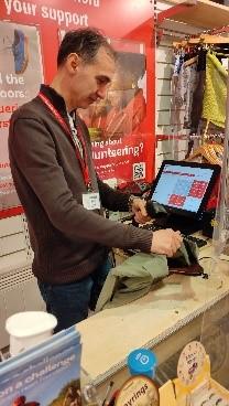 Mehmet volunteering in a charity shop